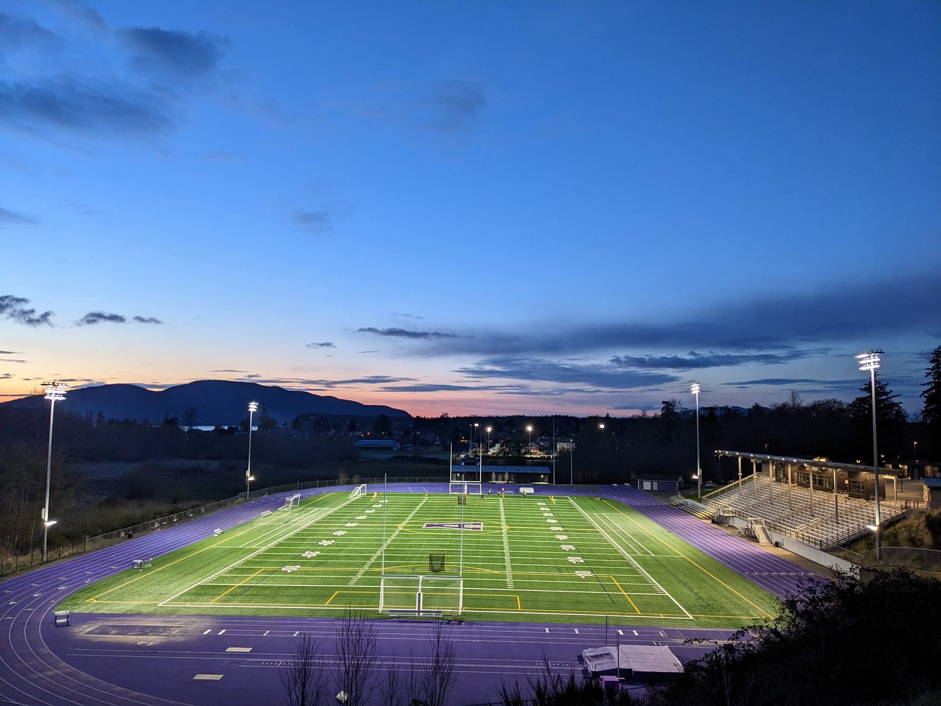 Students play soccer on Rice Field at Anacortes High School in Anacortes School District at sunset. They are depending on voters to vote YES on the Anacortes School levies coming up in 2026 to make up for the areas of their education not covered by the state and federal funding.