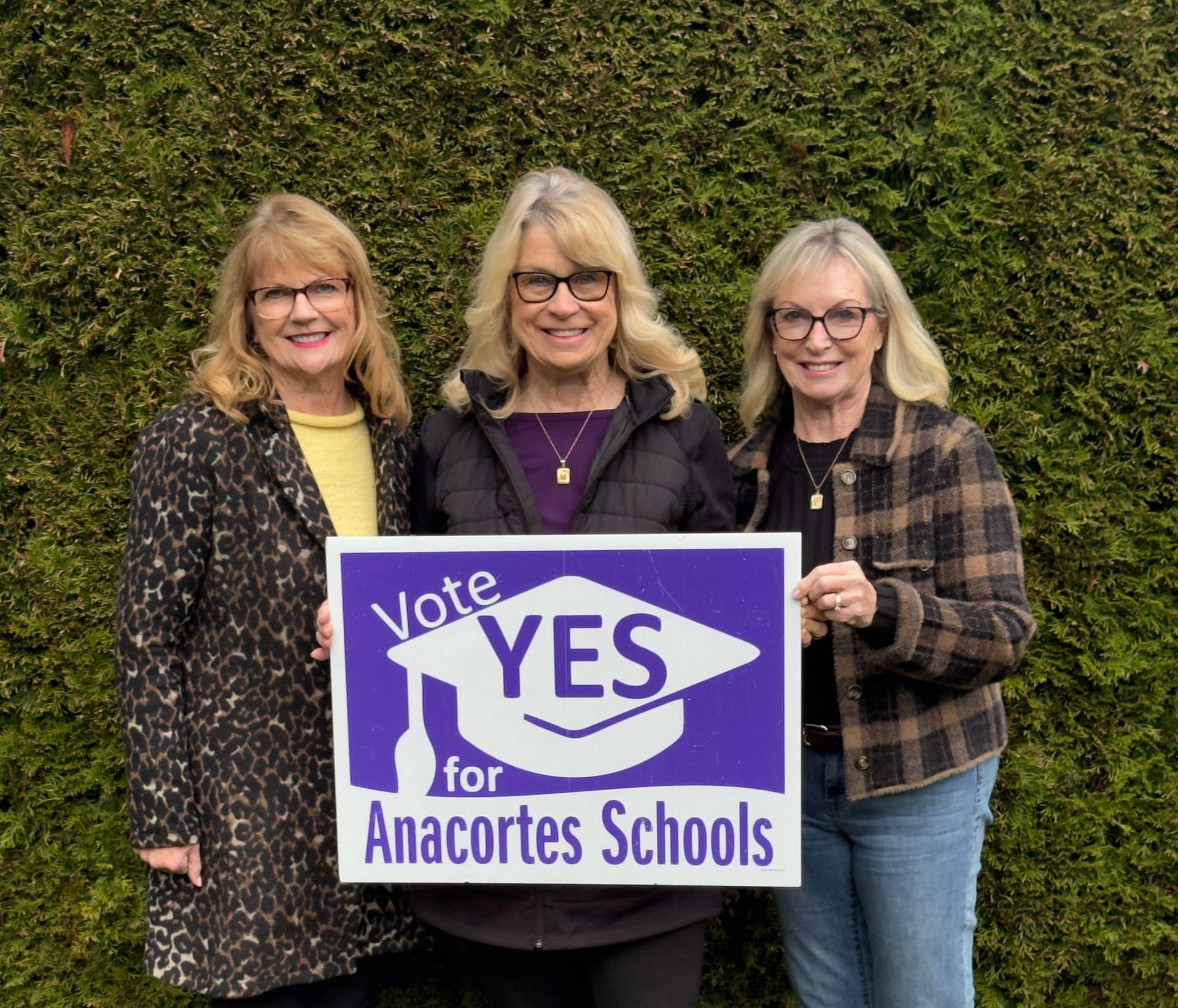 Pictured proudly showing their support for Anacortes schools are sisters Patty Johnson (retired ASD teacher), Maggie Thompson (retired ASD administrator), and Mary Kiser (retired ASD school counselor).